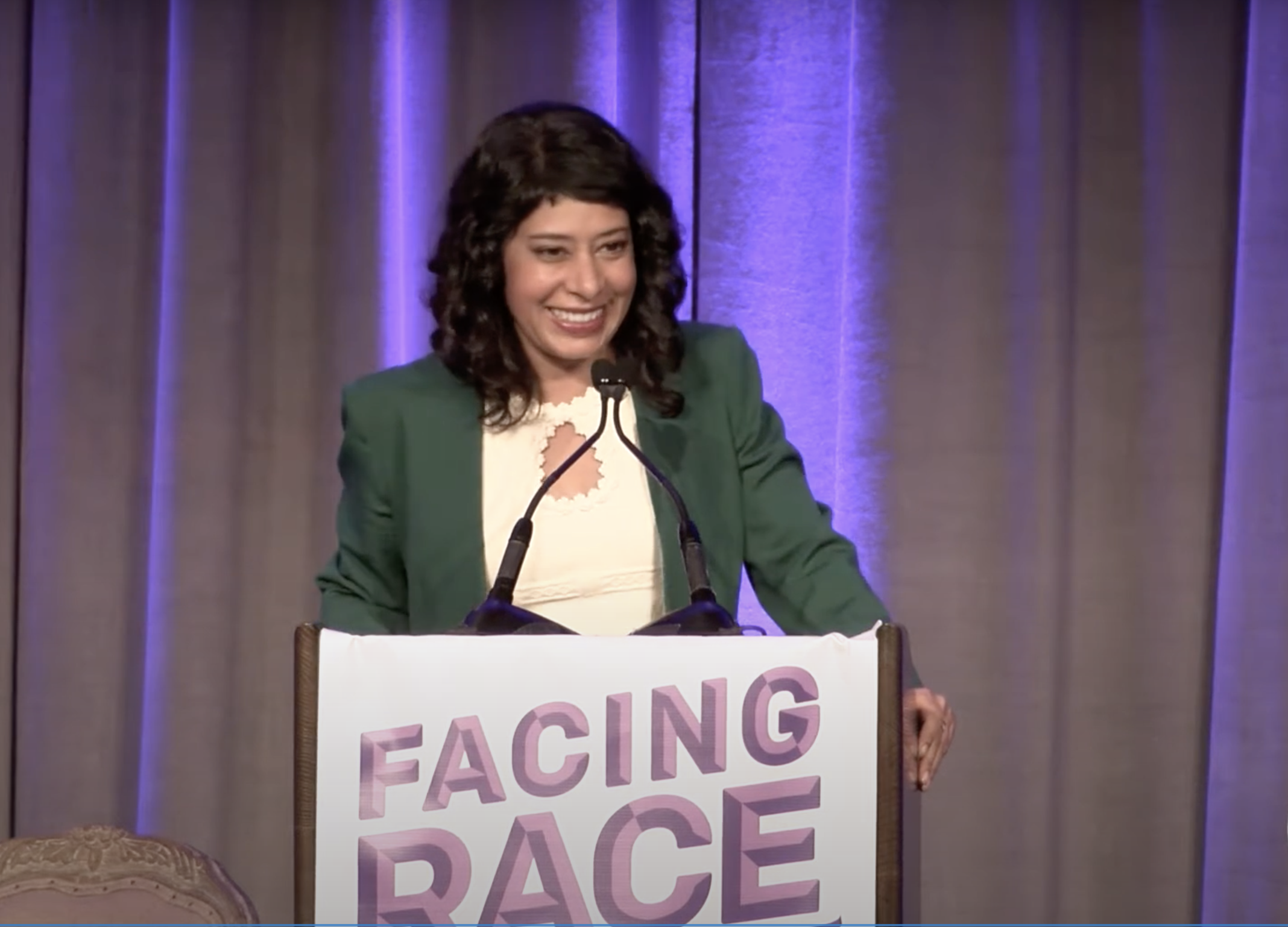 Rinku Sen, Race Forward's executive director and the publisher of ColorLines, closes out Facing Race 2016, a national conference presented by Race Forward: The Center for Racial Justice Innovation. Rinku speaks at a podium labeled "Facing Race"